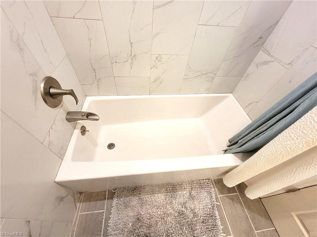 3511 Edgefield Road Greensboro, NC 27409 - Photo 14 of 16 Tub, tile and faucet installed 2020