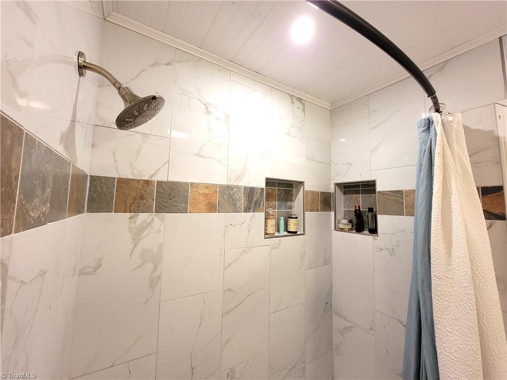 3511 Edgefield Road Greensboro, NC 27409 - Photo 15 of 16 built in shelves in shower