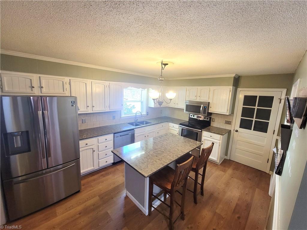 3511 Edgefield Road Greensboro, NC 27409 - Photo 3 of 16 Kitchen overview. Fridge and Dishwasher installed 2021