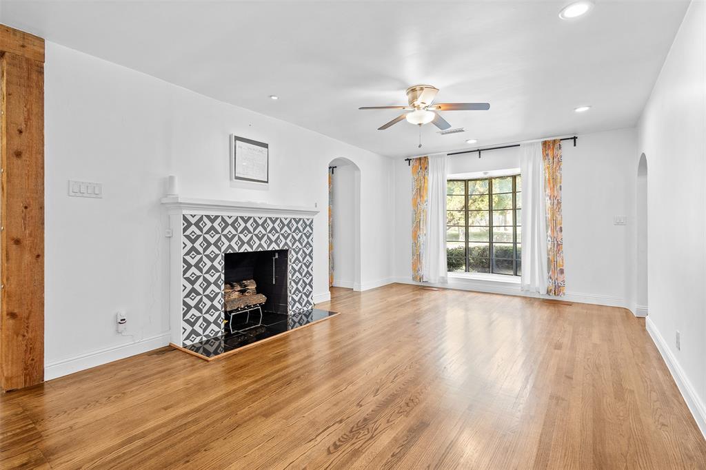 1902 Norfolk Avenue Dallas, TX 75203 - Photo 21 of 40 a view of an empty room with a fireplace and a window