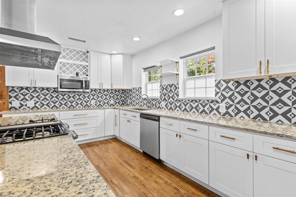1902 Norfolk Avenue Dallas, TX 75203 - Photo 24 of 40 a kitchen with granite countertop a sink and cabinets