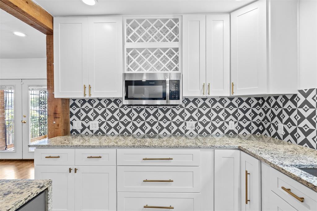 1902 Norfolk Avenue Dallas, TX 75203 - Photo 26 of 40 a bathroom with a granite countertop sink and a mirror