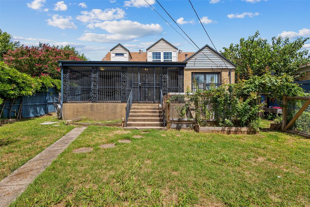 1902 Norfolk Avenue Dallas, TX 75203 - Photo 29 of 40 a front view of a house with a yard and garage