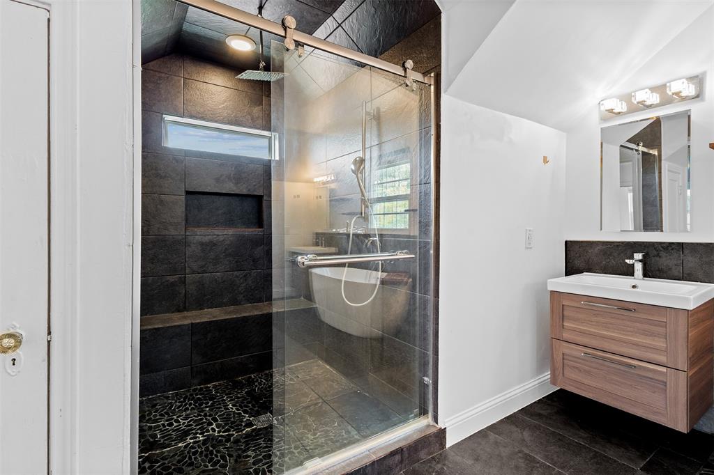 1902 Norfolk Avenue Dallas, TX 75203 - Photo 10 of 40 a bathroom with a sink and a mirror