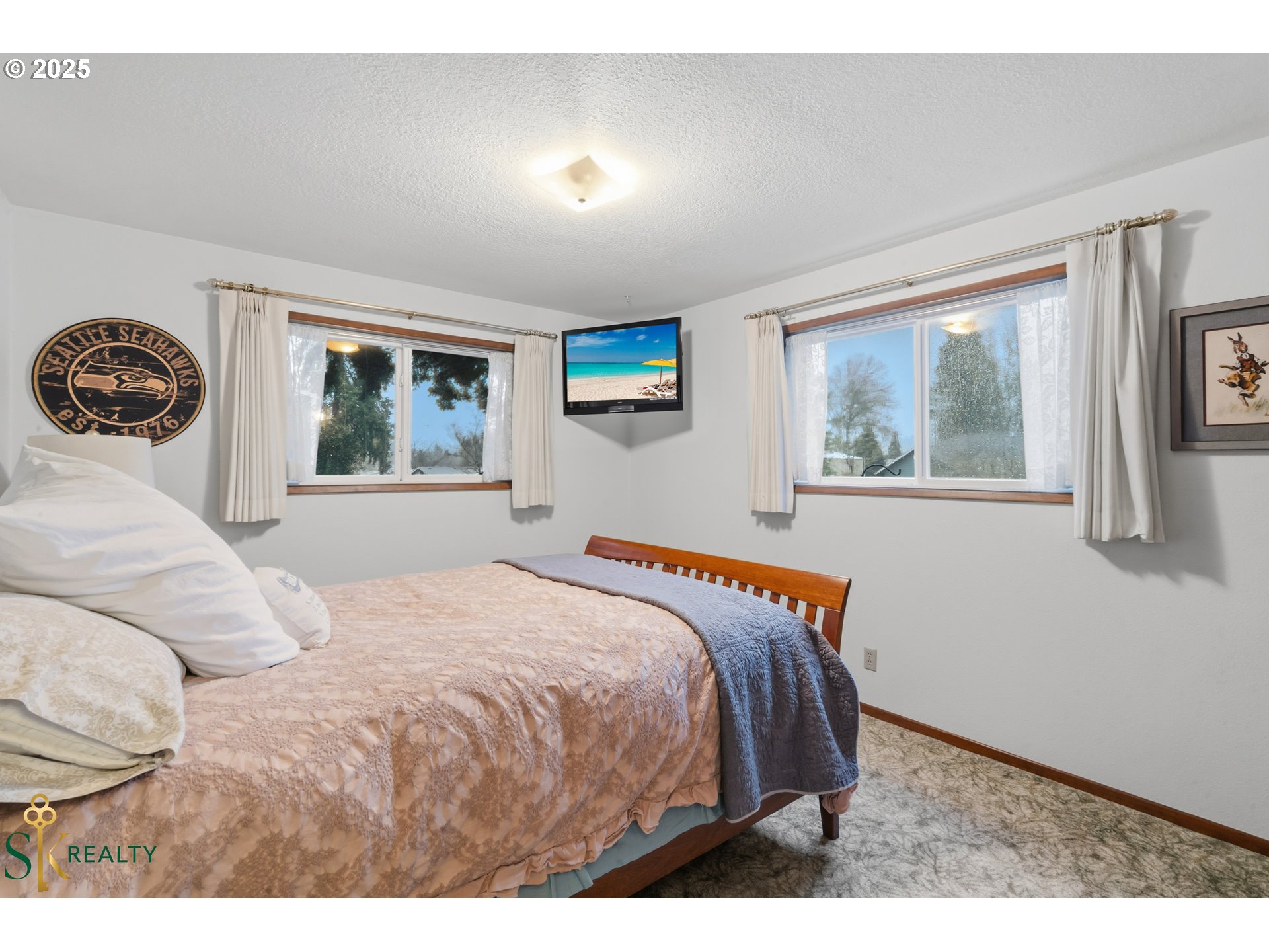 2555 Northwest Squire Place Albany, OR 97321 - Photo 30 of 44 a bedroom with a large bed and a painting on the wall