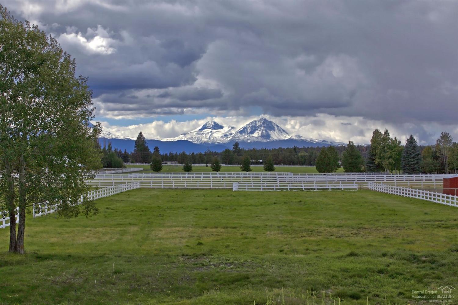 65131 Highland Road Bend, OR 97703 - Photo 2 of 22 a view of a swimming pool with a yard
