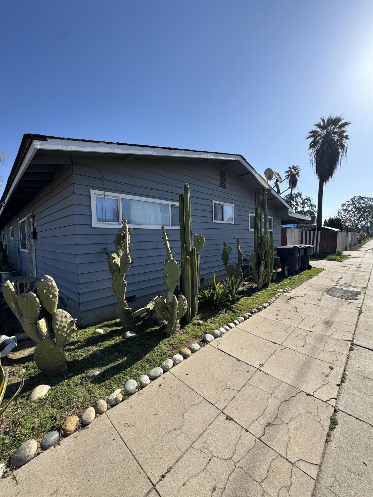 704 North Floral Street Visalia, CA 93291 - Photo 3 of 51 a front view of a house with a yard