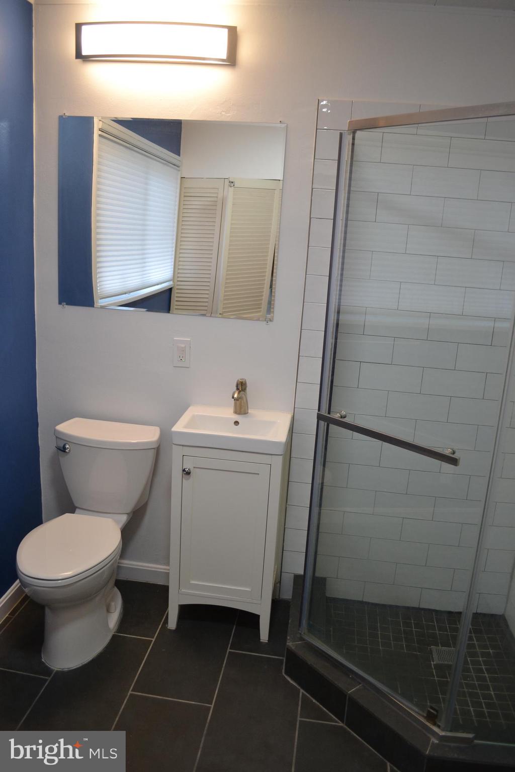 6801 Adelphi Road University Park, MD 20782 - Photo 13 of 30 The second bathroom has a stall shower.