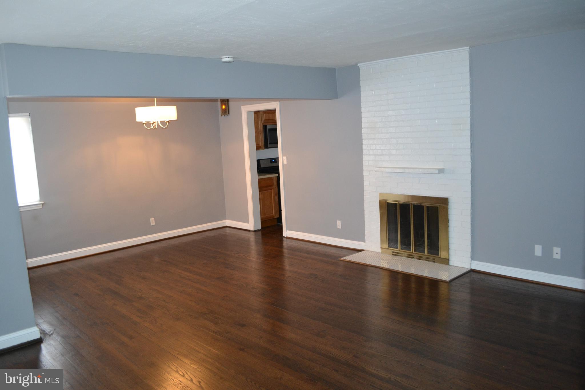 6801 Adelphi Road University Park, MD 20782 - Photo 3 of 30 Hardwood floors and combination living and dining.