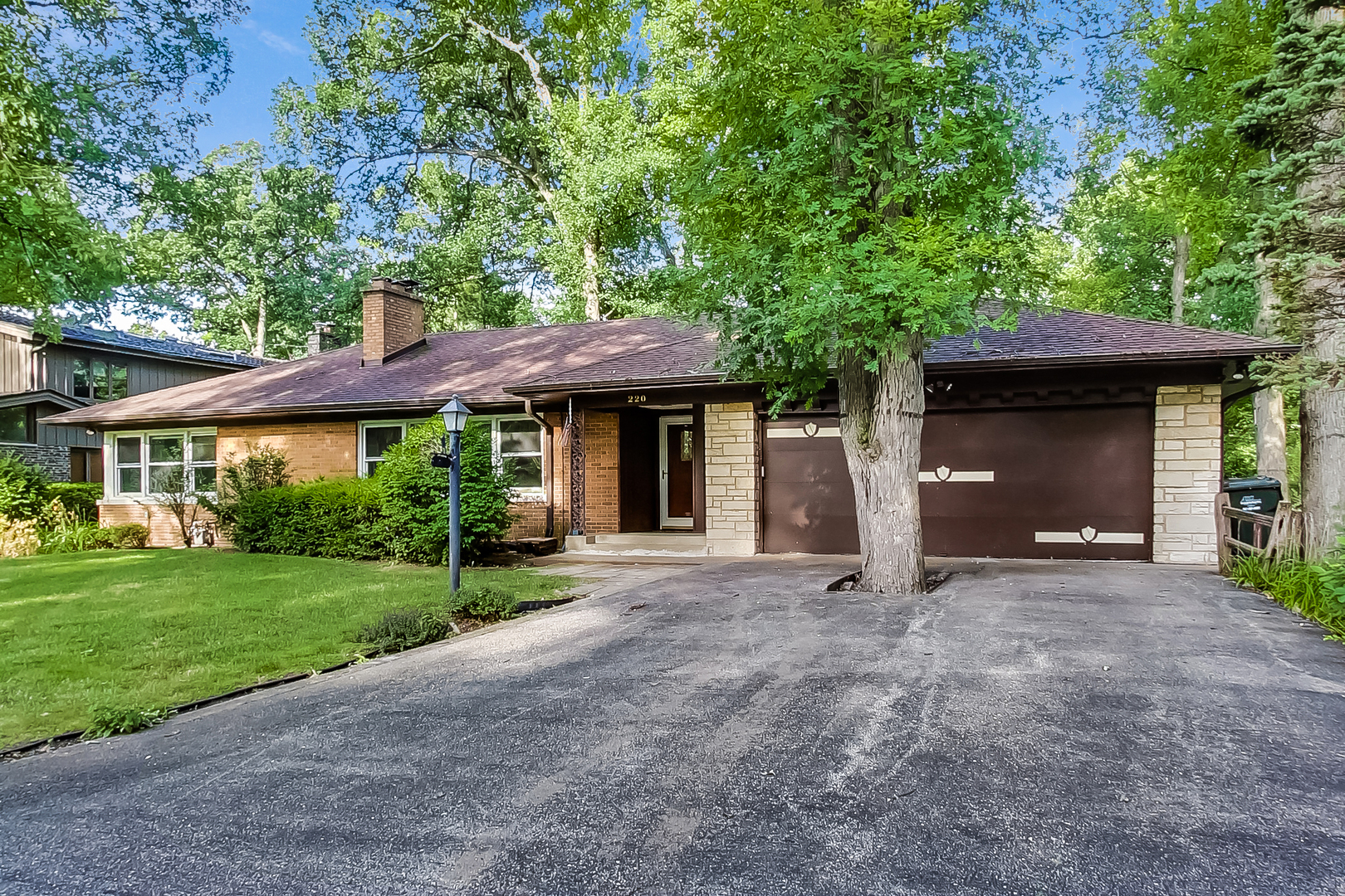 220 South Rose Avenue Park Ridge, IL 60068 - Photo 1 of 25 a front view of a house with a garden