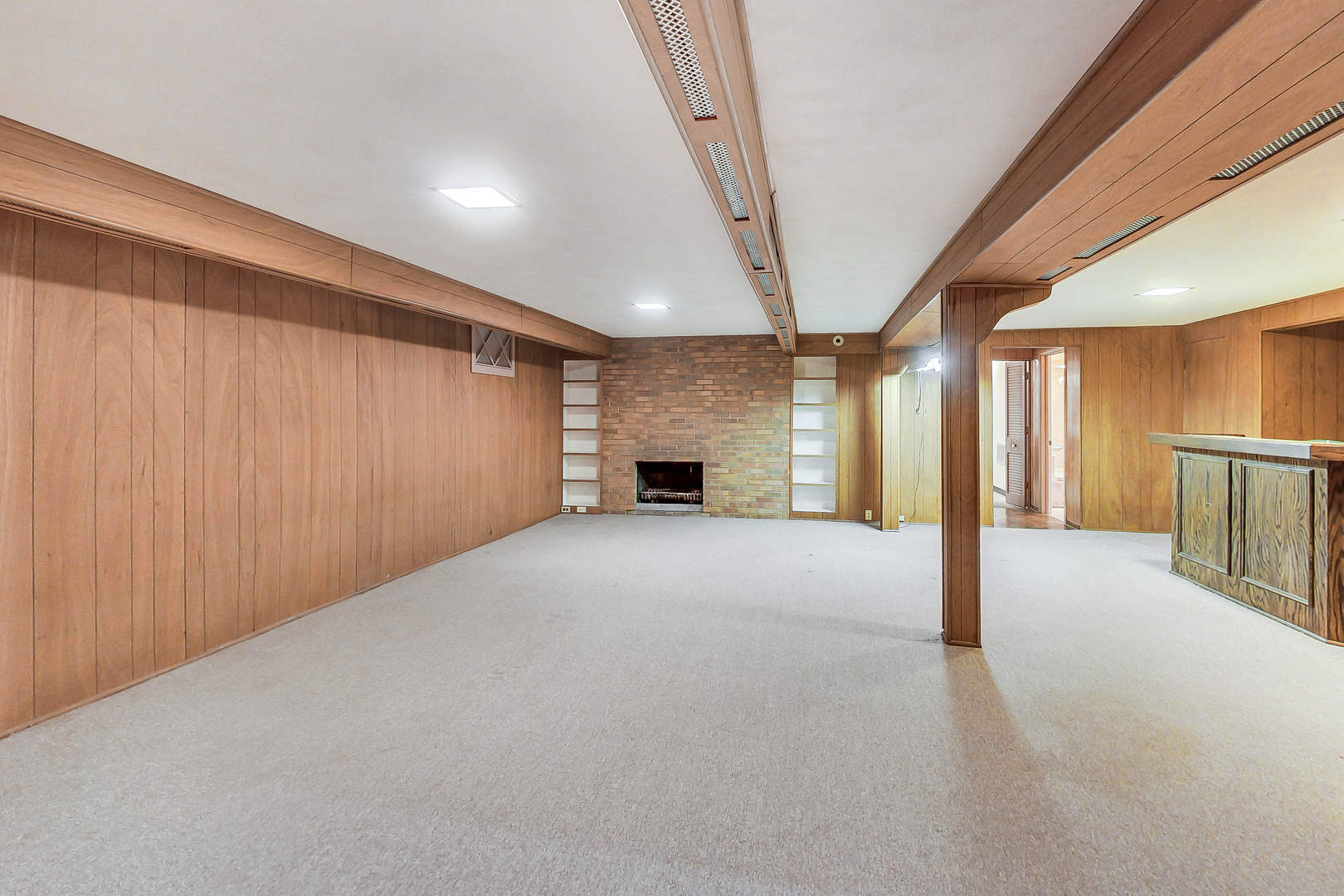 220 South Rose Avenue Park Ridge, IL 60068 - Photo 15 of 25 a view of an empty room with a fireplace and a window
