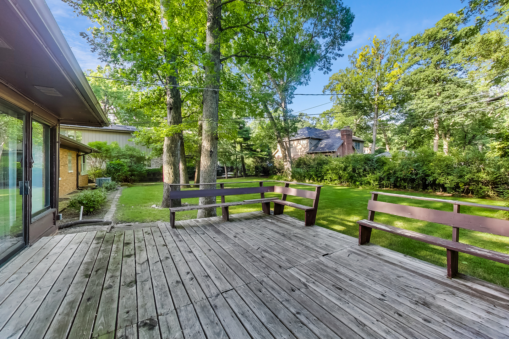 220 South Rose Avenue Park Ridge, IL 60068 - Photo 18 of 25 a view of a deck with chairs and wooden floor