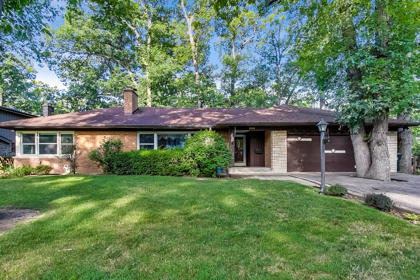 220 South Rose Avenue Park Ridge, IL 60068 - Photo 2 of 25 a front view of a house with a garden
