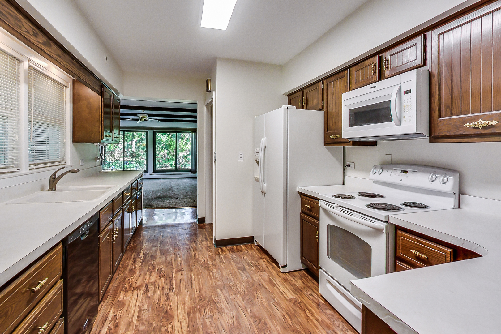 220 South Rose Avenue Park Ridge, IL 60068 - Photo 8 of 25 a kitchen with a stove a sink and a microwave
