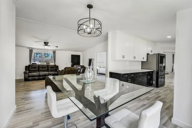 a view of a dining room kitchen and a wooden floor