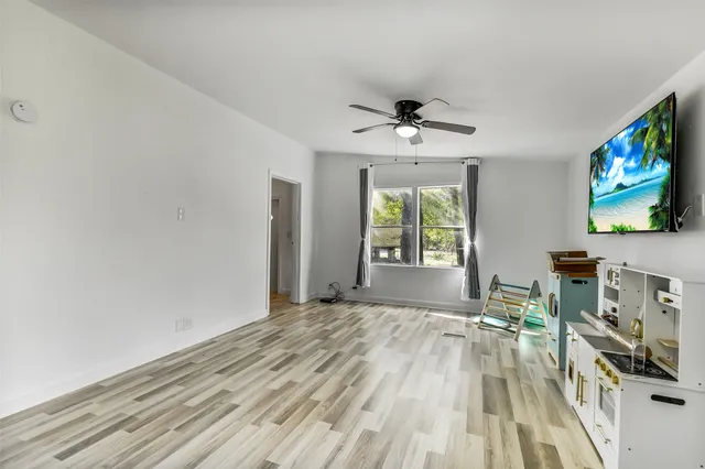 a view of a livingroom with a flat screen tv