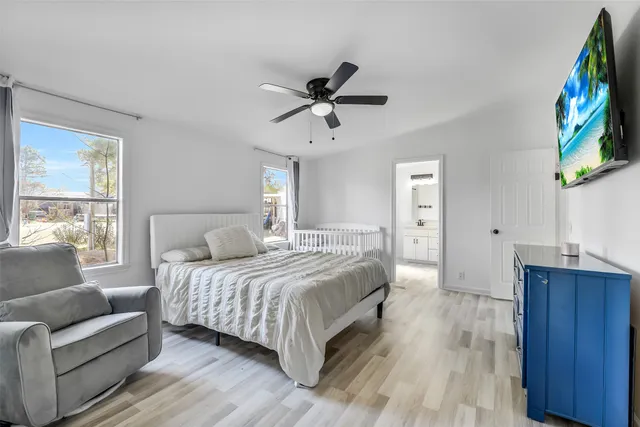 a bedroom with a bed and a couch