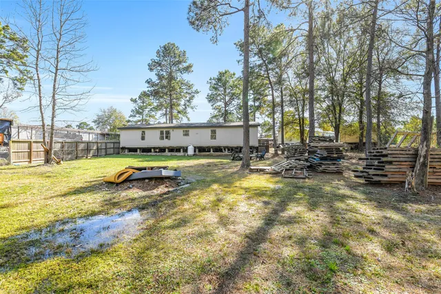 a view of swimming pool with outdoor seating and yard