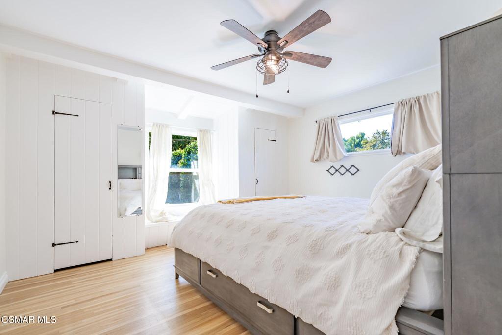 4310 Eve Road Simi Valley, CA 93063 - Photo 23 of 50 a spacious bedroom with a bed and a chandelier