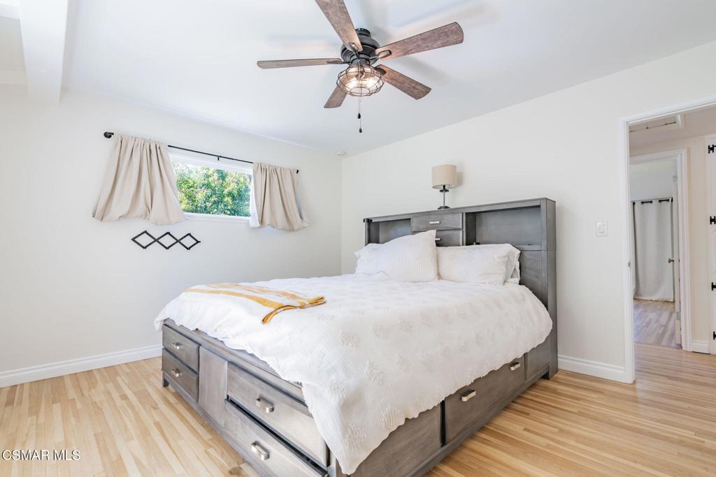 4310 Eve Road Simi Valley, CA 93063 - Photo 24 of 50 a bedroom with bed and a chandelier