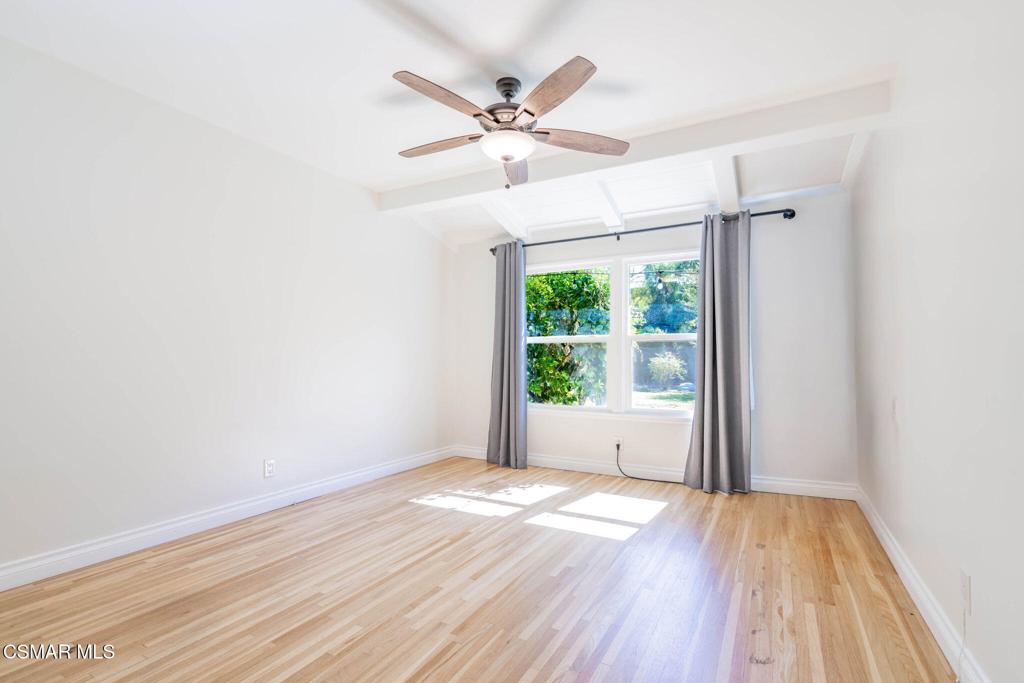4310 Eve Road Simi Valley, CA 93063 - Photo 29 of 50 an empty room with wooden floor fan and windows
