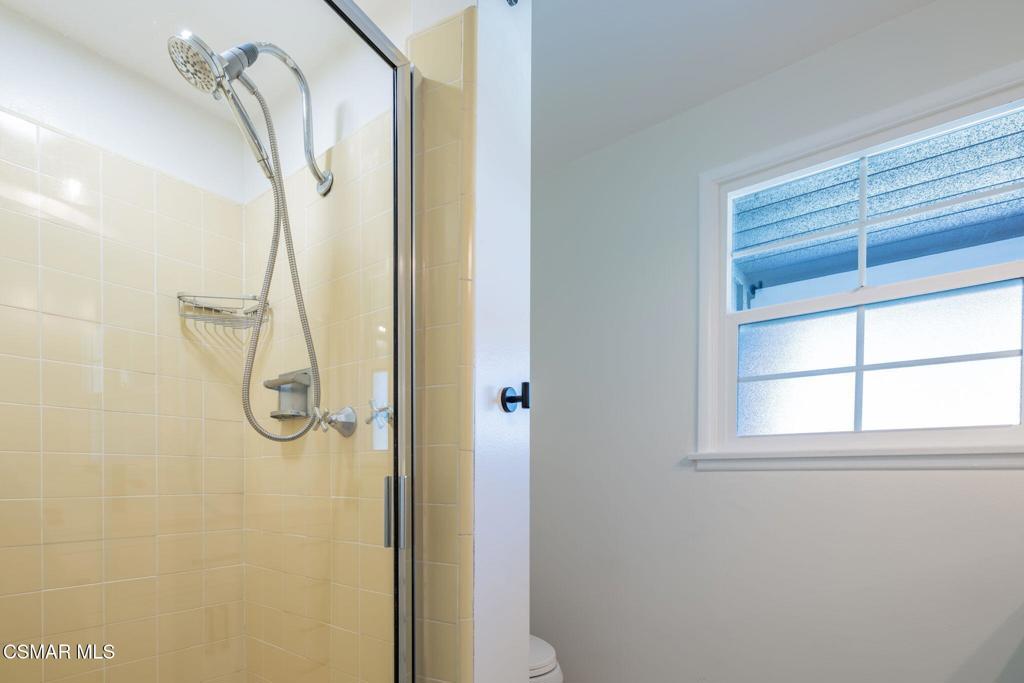 4310 Eve Road Simi Valley, CA 93063 - Photo 32 of 50 a bathroom with a glass shower door