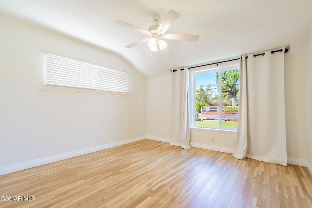 4310 Eve Road Simi Valley, CA 93063 - Photo 34 of 50 a view of an empty room with a window and wooden floor