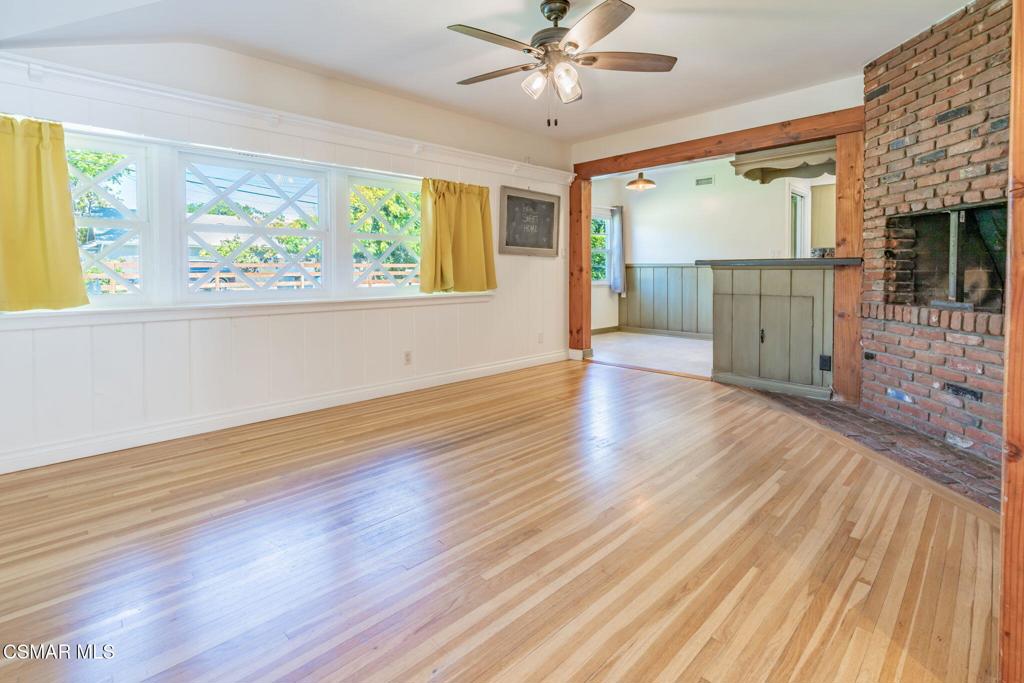 4310 Eve Road Simi Valley, CA 93063 - Photo 10 of 50 a view of a livingroom with wooden floor and a ceiling fan