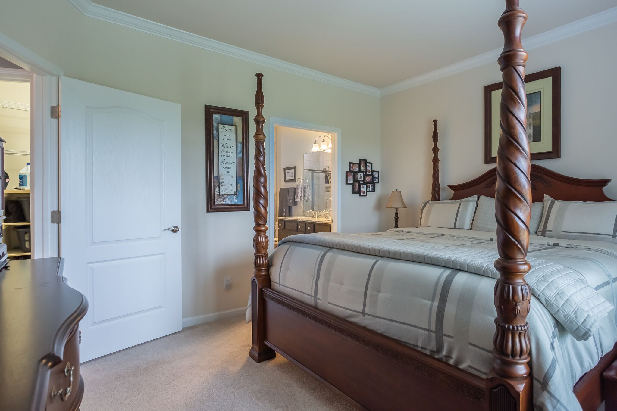 126 Tipton Pass Spring Hill, TN 37174 - Photo 18 of 35 a large bed sitting in a bedroom next to a window