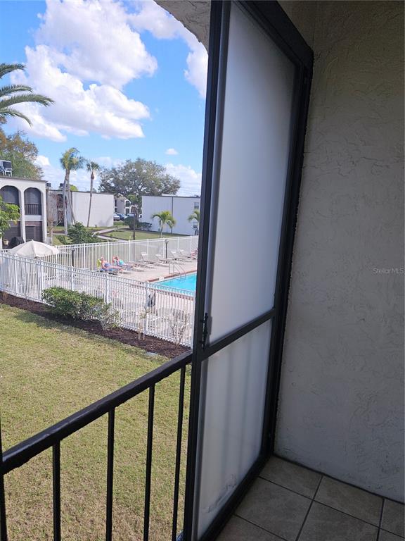 7701 Starkey Road, Unit 102 Seminole, FL 33777 - Photo 11 of 24 a view of swimming pool from a balcony