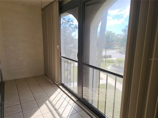 a view of empty room with windows
