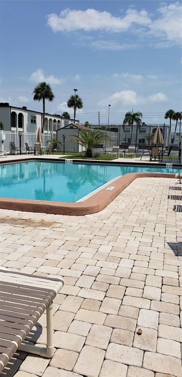 7701 Starkey Road, Unit 102 Seminole, FL 33777 - Photo 16 of 24 a view of swimming pool of a house