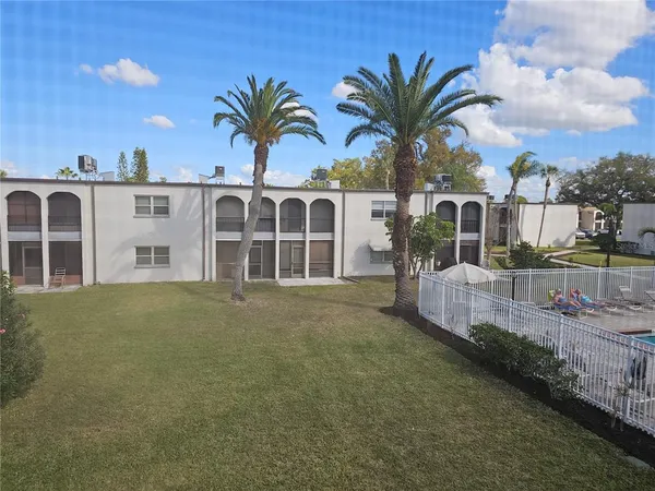 a view of a house with a garden and yard