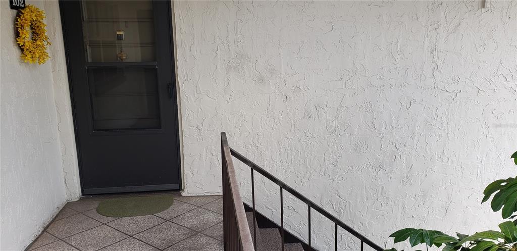 7701 Starkey Road, Unit 102 Seminole, FL 33777 - Photo 21 of 24 a view of stairs