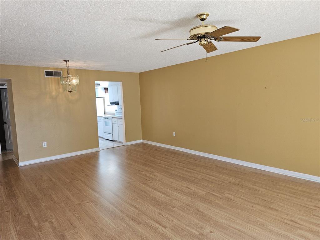 7701 Starkey Road, Unit 102 Seminole, FL 33777 - Photo 3 of 24 a view of a room with wooden floor