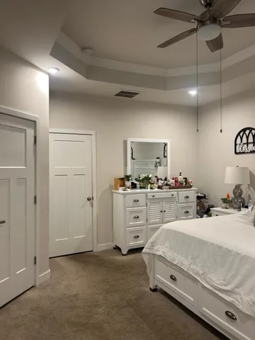 a room with a bed and furniture