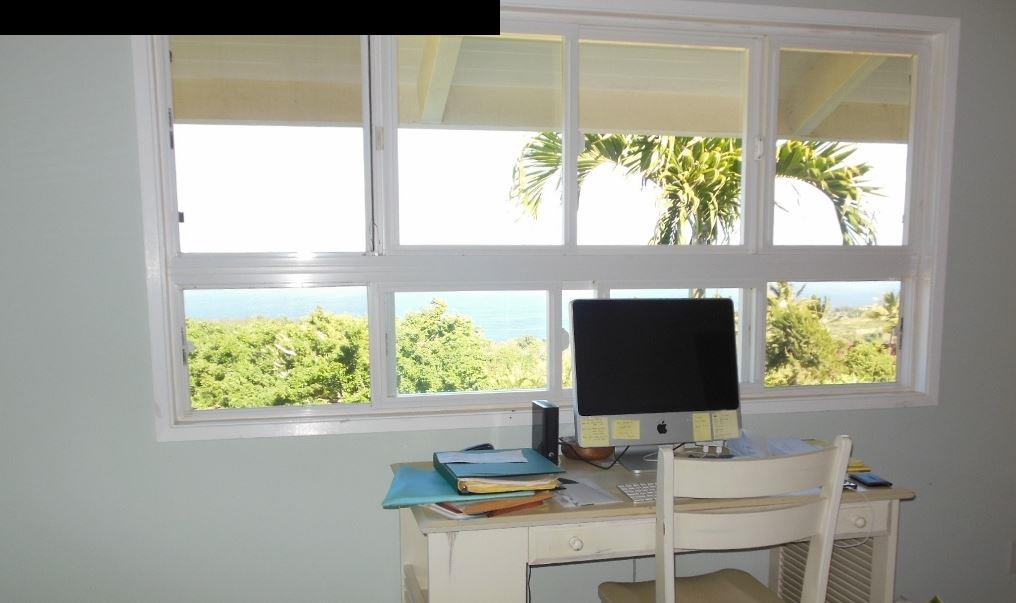 85 Heaaula Street Haiku, HI 96708 - Photo 23 of 29 a desktop computer sitting on top of a wooden floor