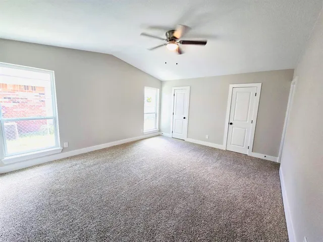 a view of a kitchen with a sink and cabinets