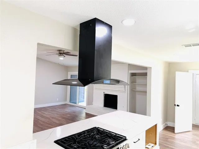 a kitchen with stainless steel appliances a stove and a refrigerator