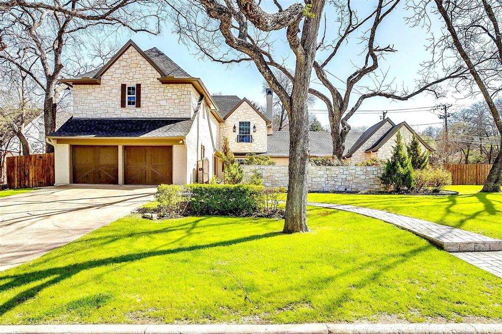 a front view of house with yard and swimming pool