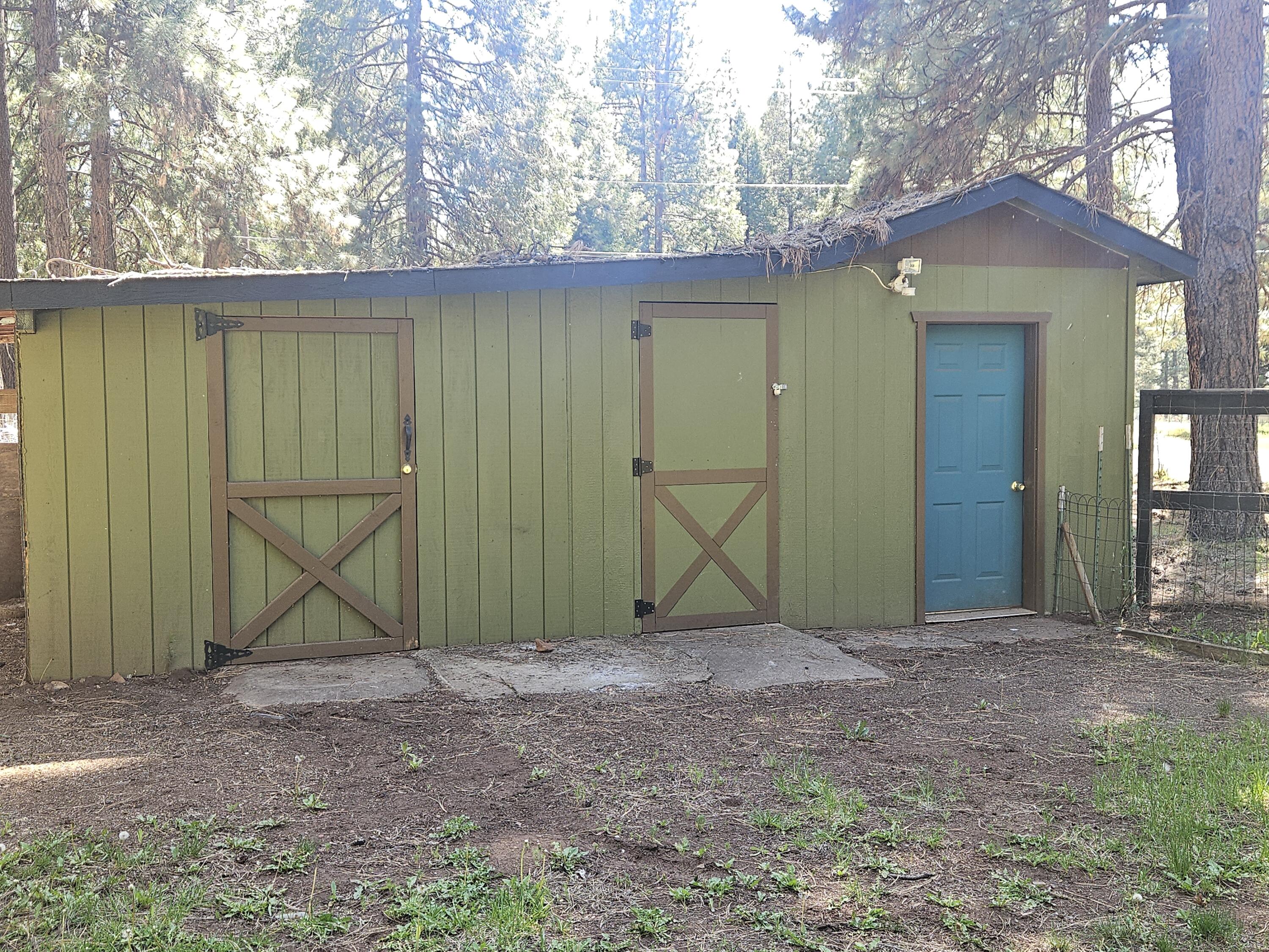 18015 Freight Rd Lane Klamath Falls, OR 97601 - Photo 24 of 24 a view of a wooden house with a yard and a large tree