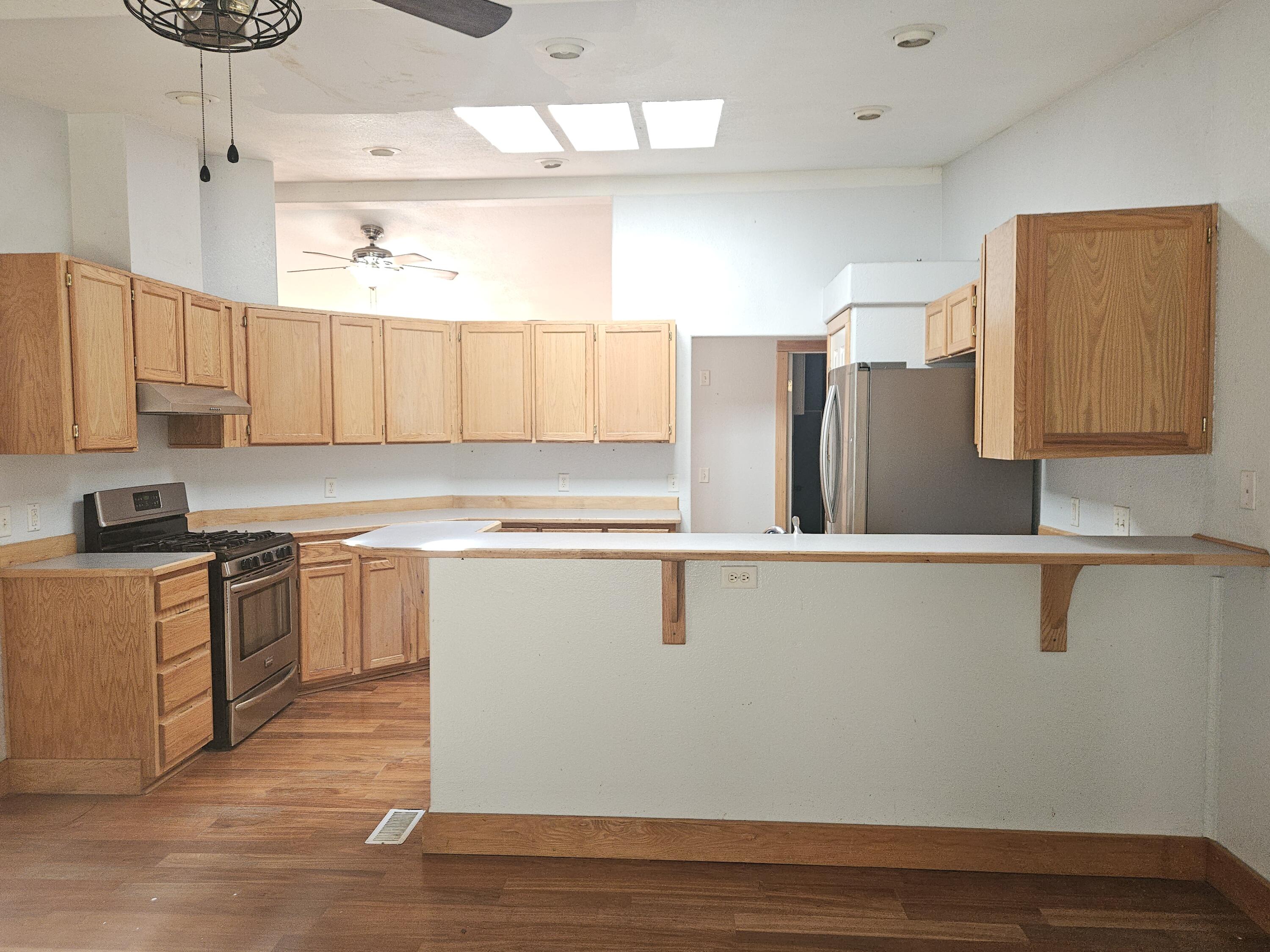18015 Freight Rd Lane Klamath Falls, OR 97601 - Photo 5 of 24 a kitchen with stainless steel appliances granite countertop a refrigerator and a stove top oven