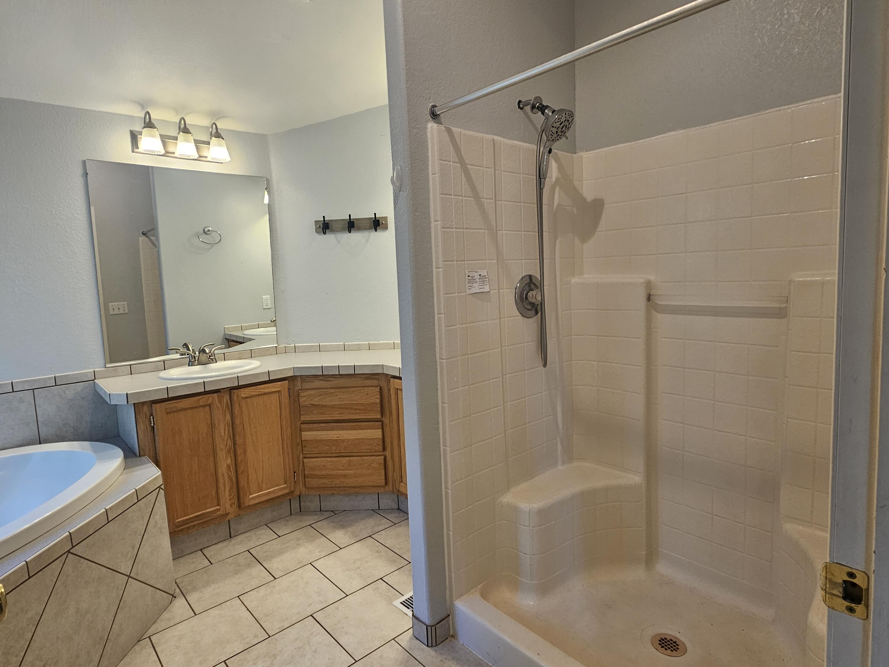 18015 Freight Rd Lane Klamath Falls, OR 97601 - Photo 9 of 24 a bathroom with a granite countertop sink a toilet and shower