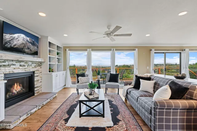 a living room with furniture and a fireplace