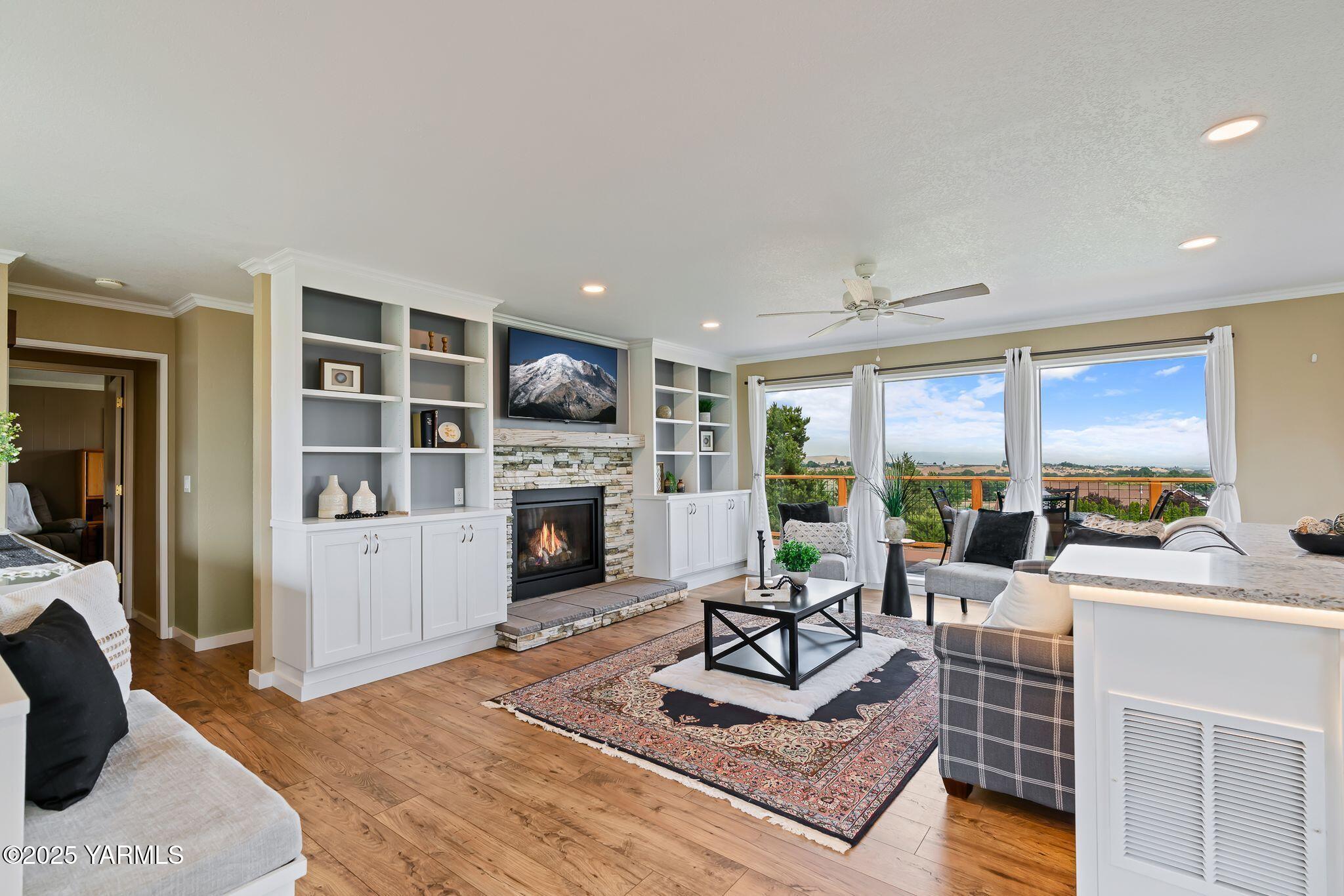 283 Cook Road Yakima, WA 98908 - Photo 15 of 64 a living room with furniture a rug and a fireplace