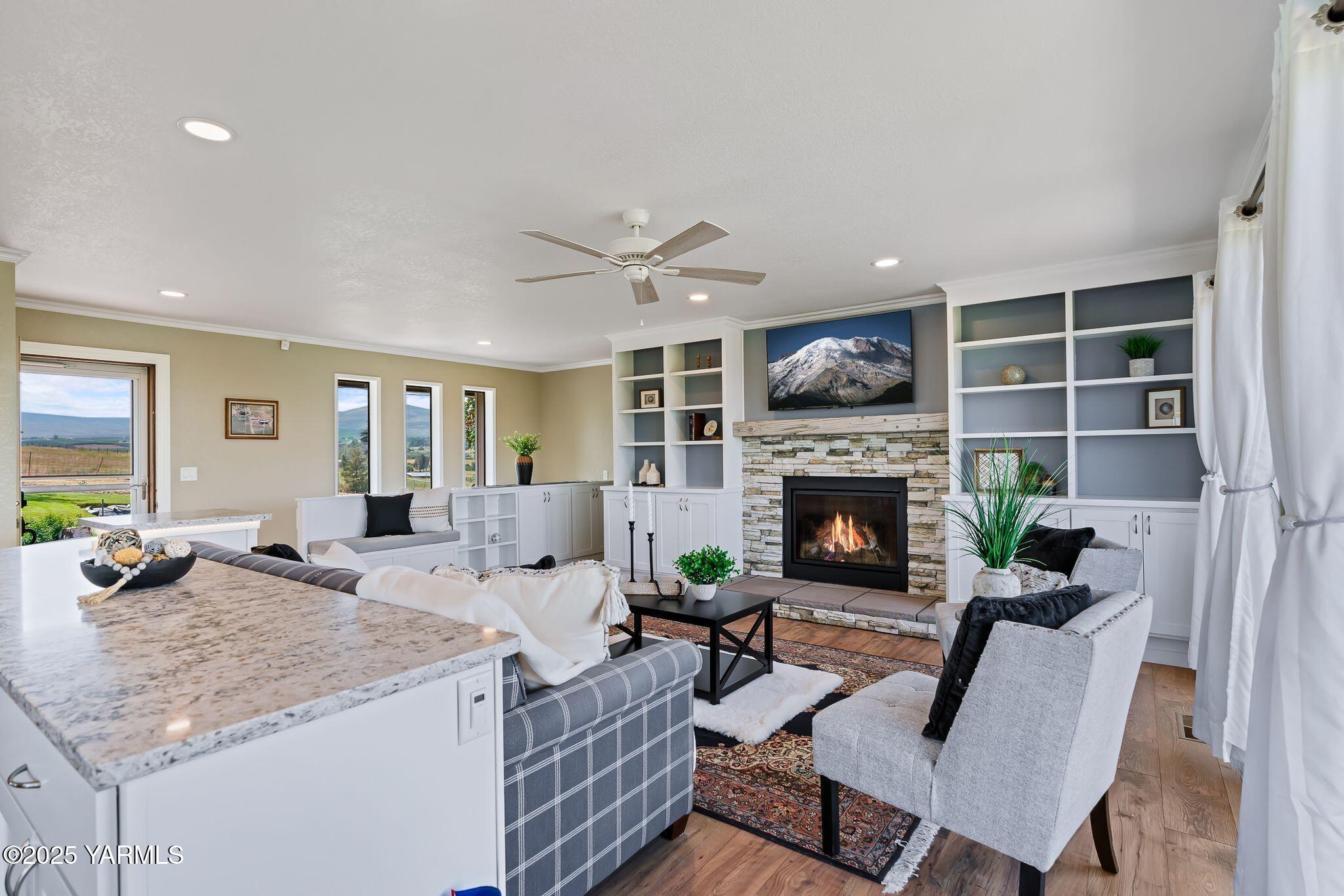 283 Cook Road Yakima, WA 98908 - Photo 16 of 64 a living room with furniture and a fireplace