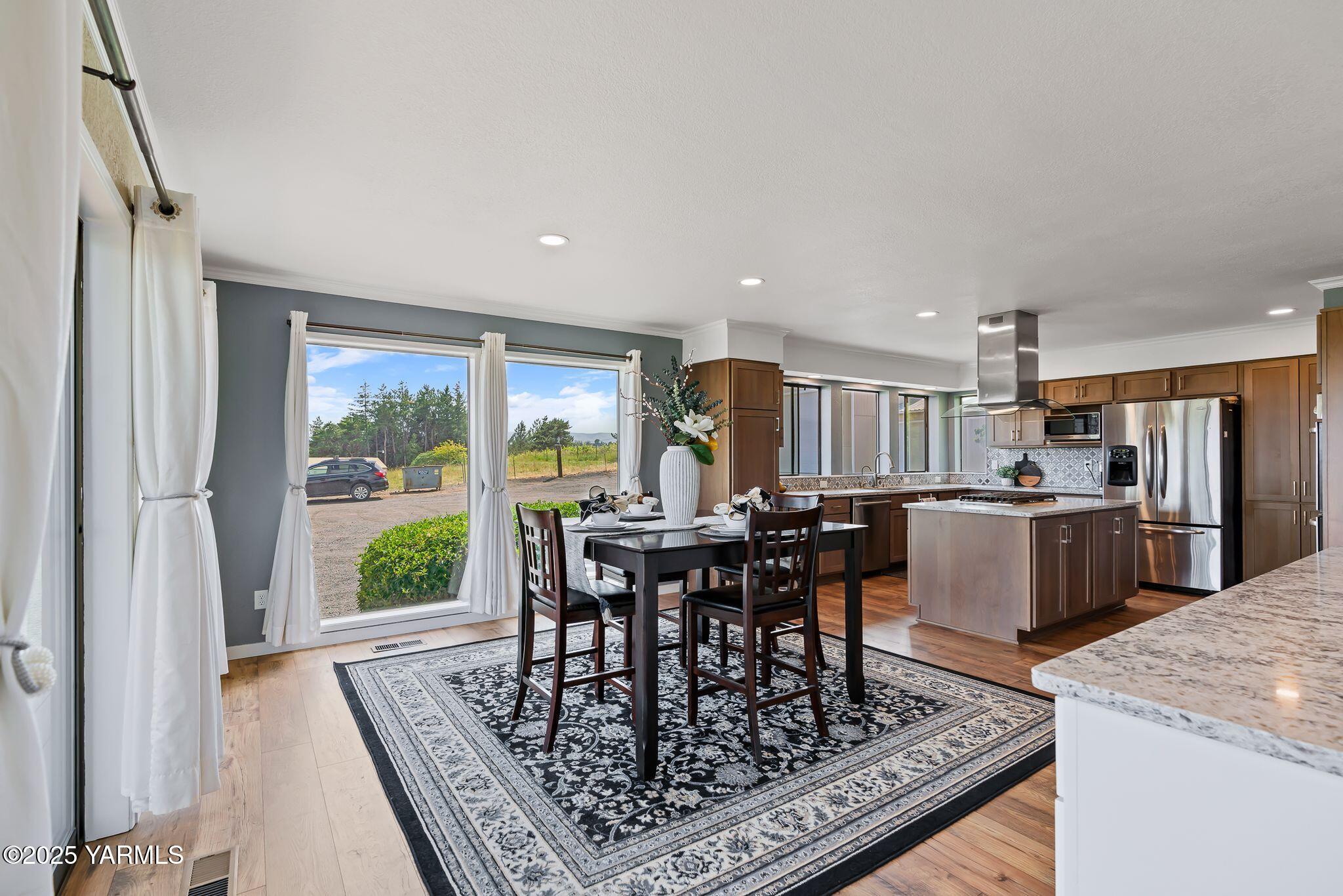 283 Cook Road Yakima, WA 98908 - Photo 18 of 64 a view of a dining room with furniture window and outside view