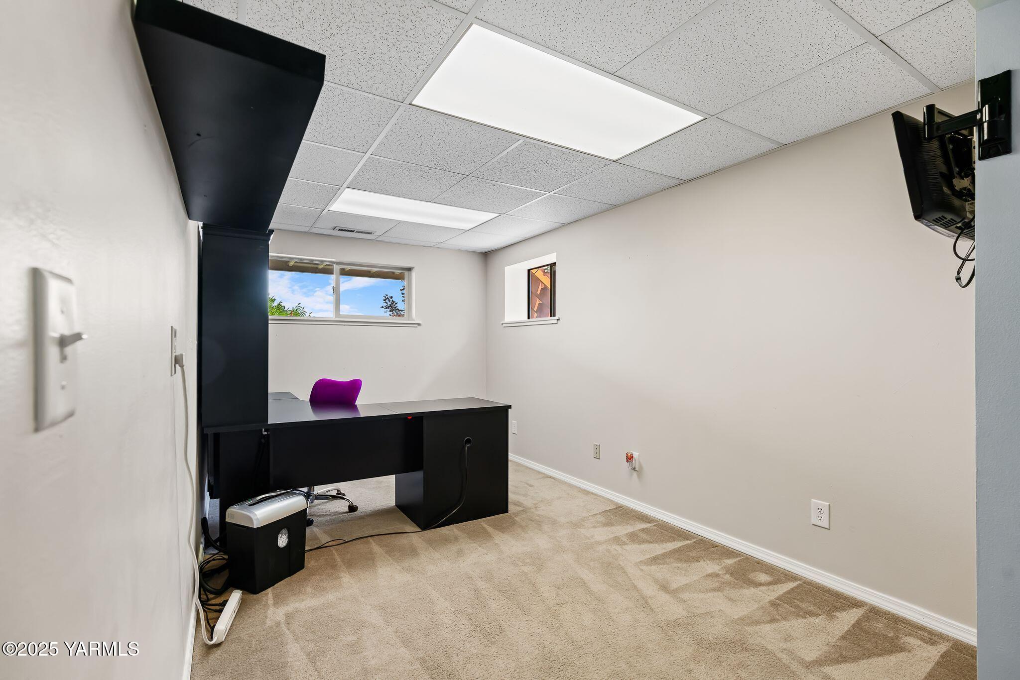 283 Cook Road Yakima, WA 98908 - Photo 38 of 64 a living room with a flat screen tv and a refrigerator