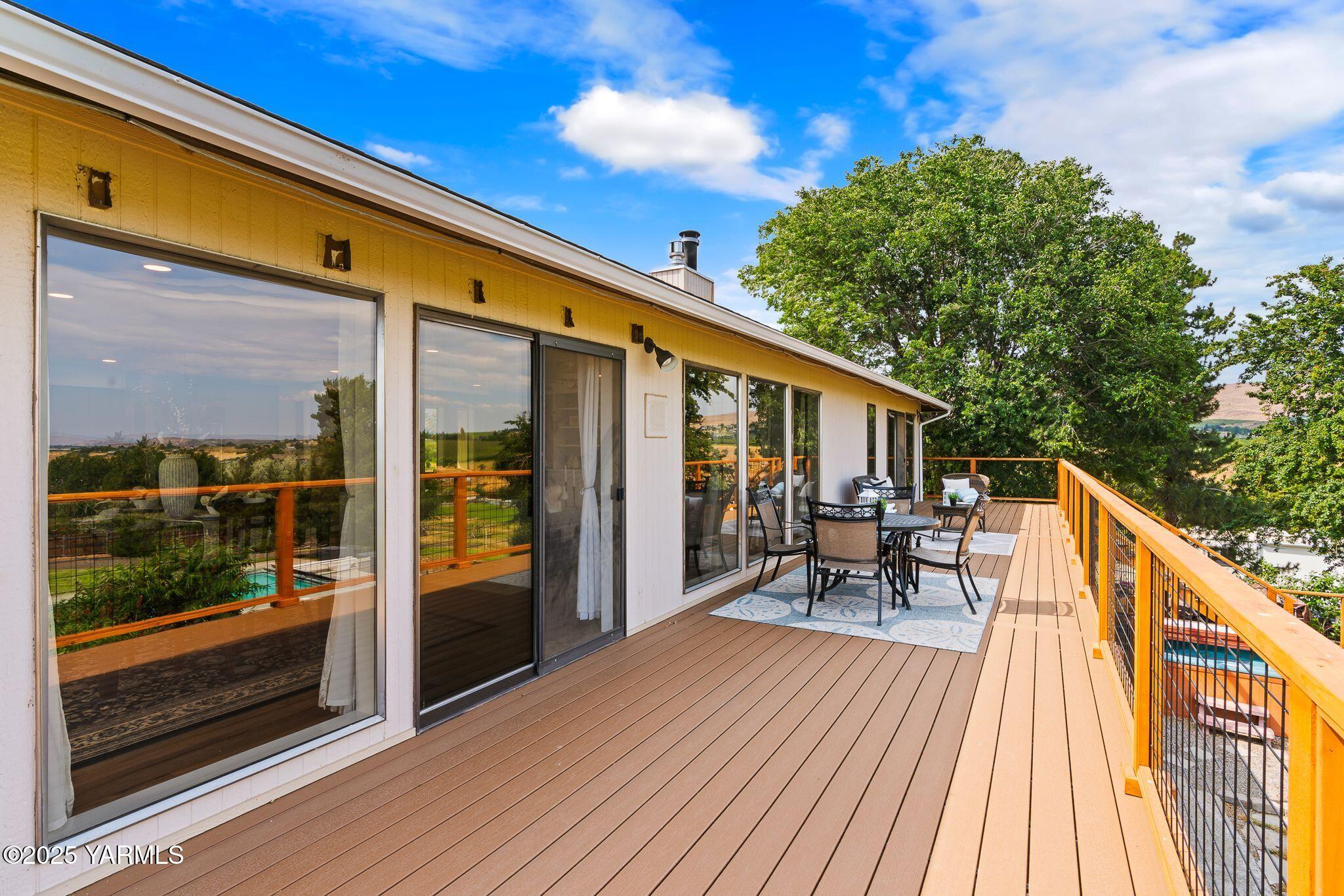 283 Cook Road Yakima, WA 98908 - Photo 49 of 64 a balcony with wooden floor and outdoor seating