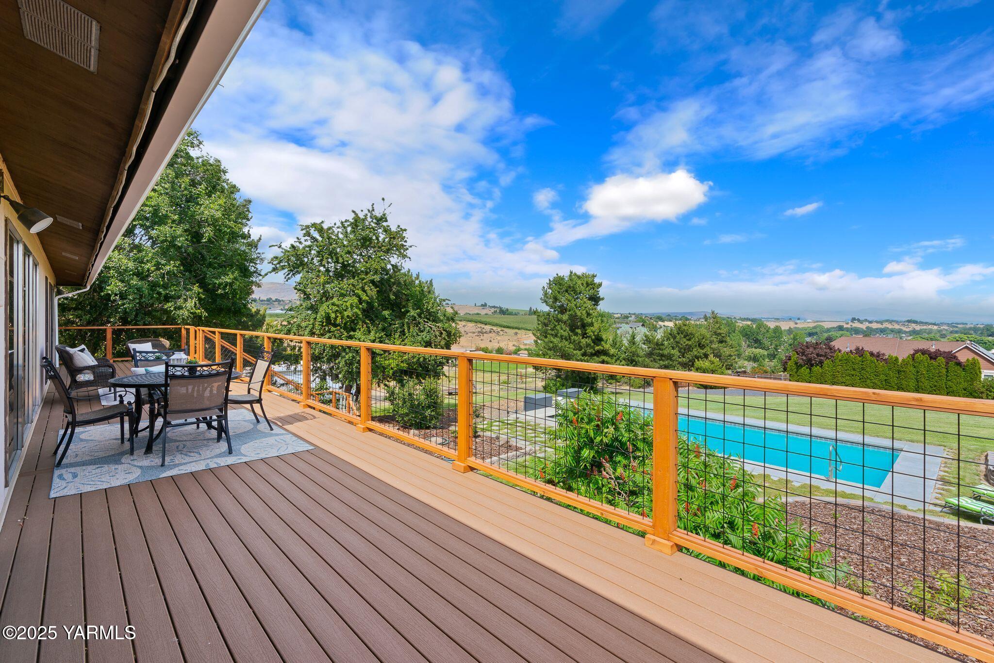 283 Cook Road Yakima, WA 98908 - Photo 50 of 64 a view of a balcony with wooden floor and iron fence